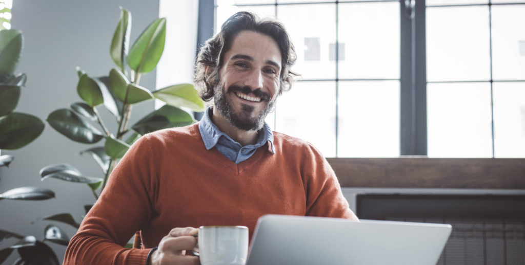 Man with Laptop and mug